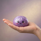 Coffret 6 Squishy Dumpling à Paillettes — une pièce tenue dans la main