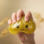 Squishy Dumpling Doré à Paillettes — en cours de compression