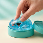 Squishy Dumpling Mystère Été — pressé entre les doigts