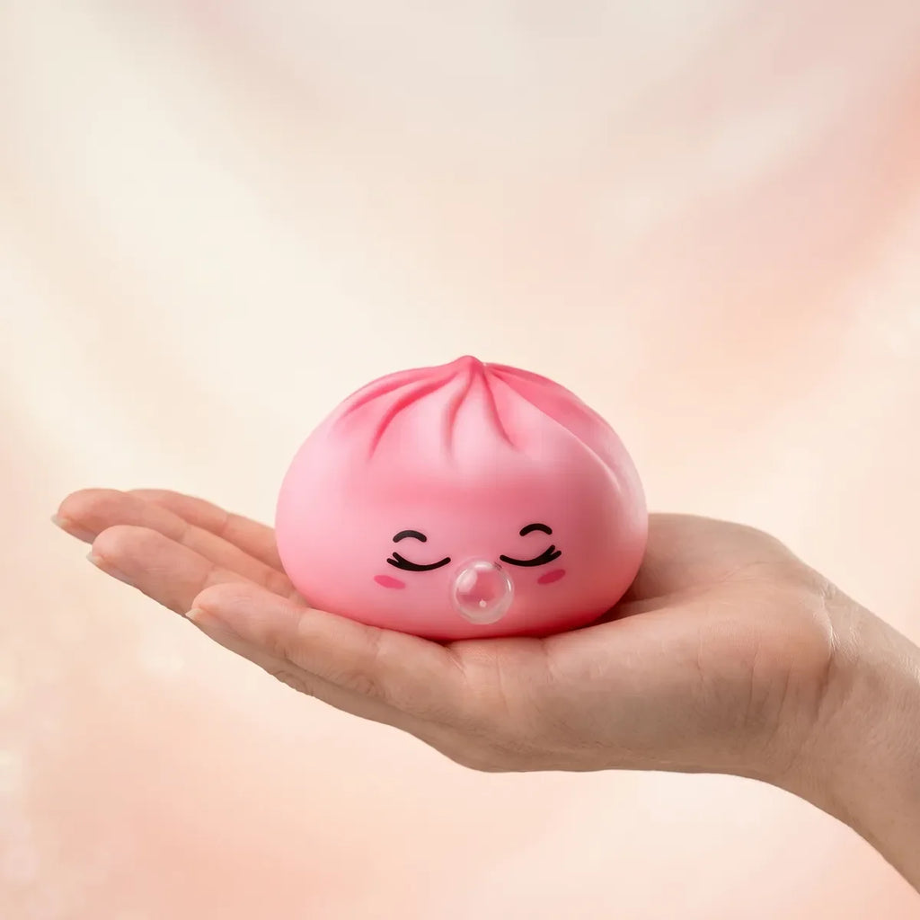 Squishy Dumpling Bubble Rose Marbré — tenu dans la main