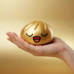 Squishy Dumpling Or Chromé — tenu dans la main