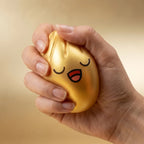 Squishy Dumpling Or Chromé — en situation de jeu