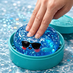 Squishy Dumpling à Lunettes Pailleté — pressé entre les doigts