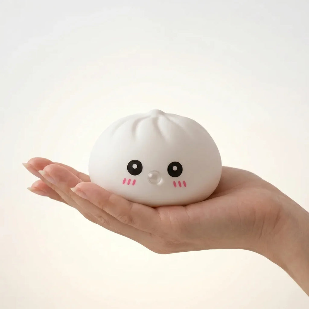 Squishy Dumpling Bubble Blanc — tenu dans la main